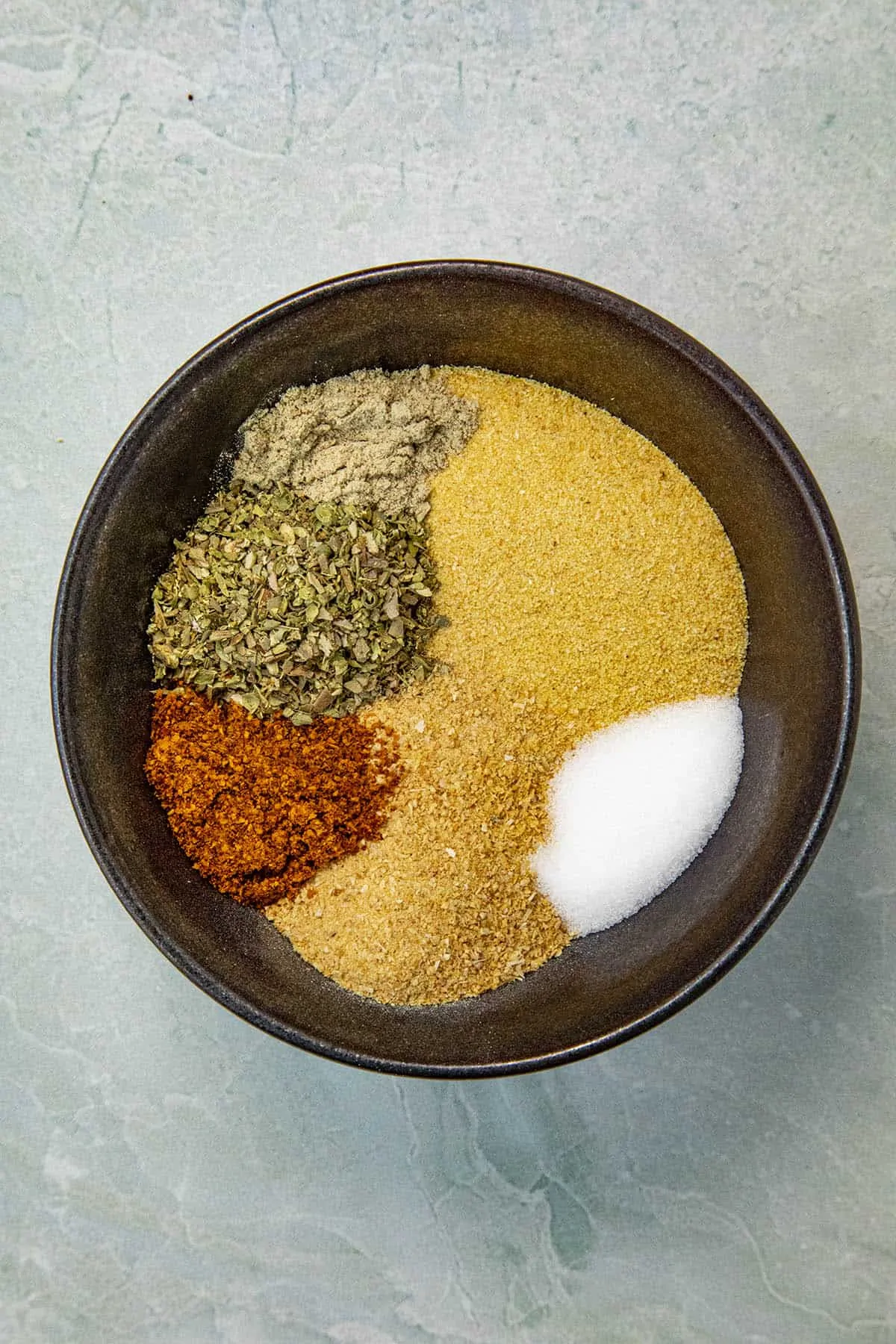 Adobo Seasoning ingredients in a bowl, ready to mix.