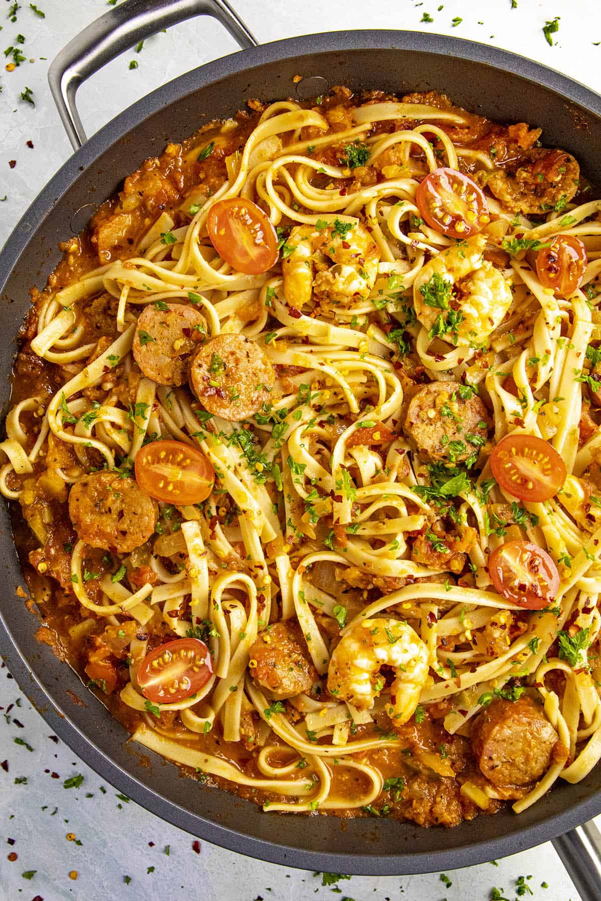 Cajun pasta in a pan with lots of shrimp and andouille.