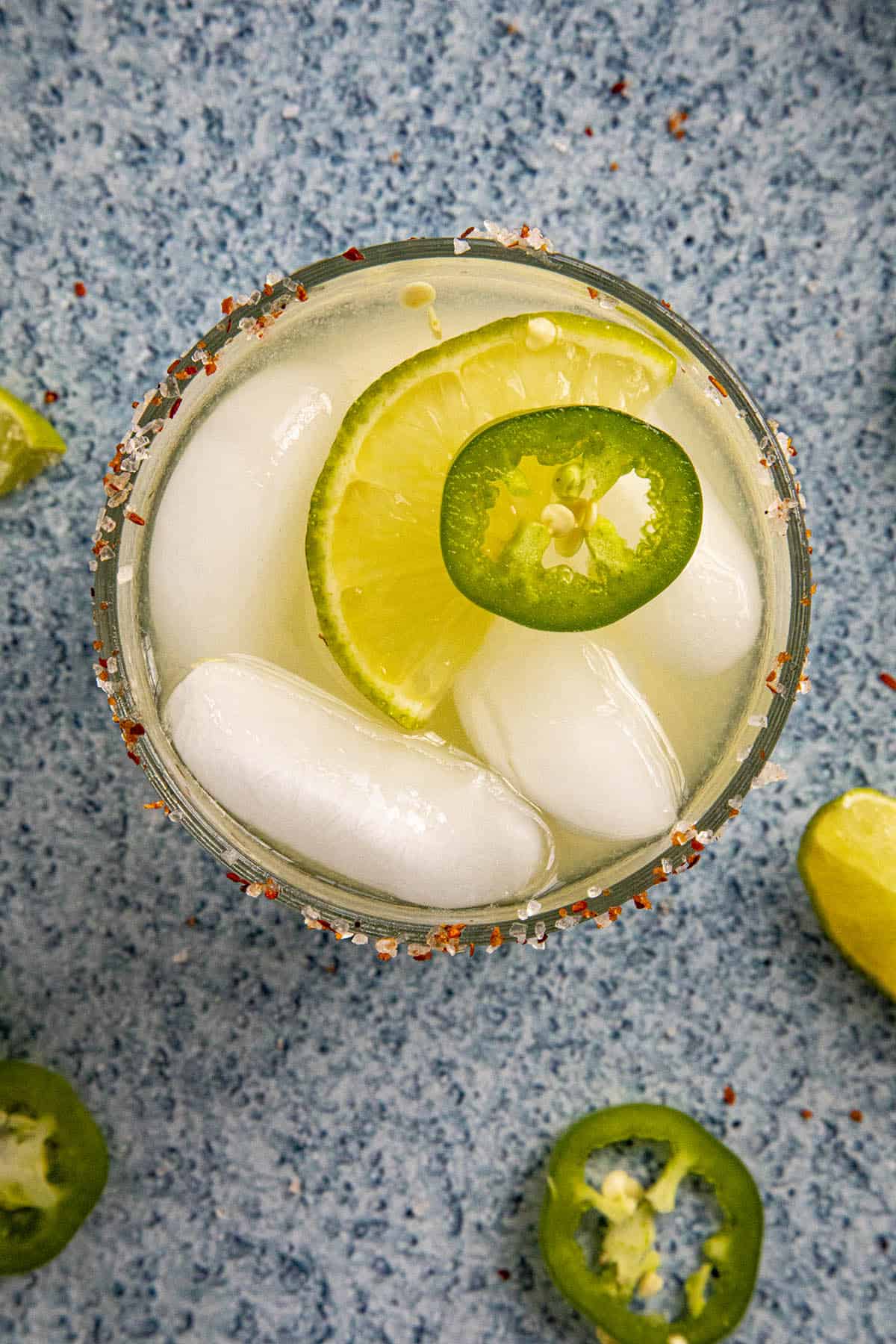 Jalapeno Margarita garnished with a lime wedge and jalapeno slice