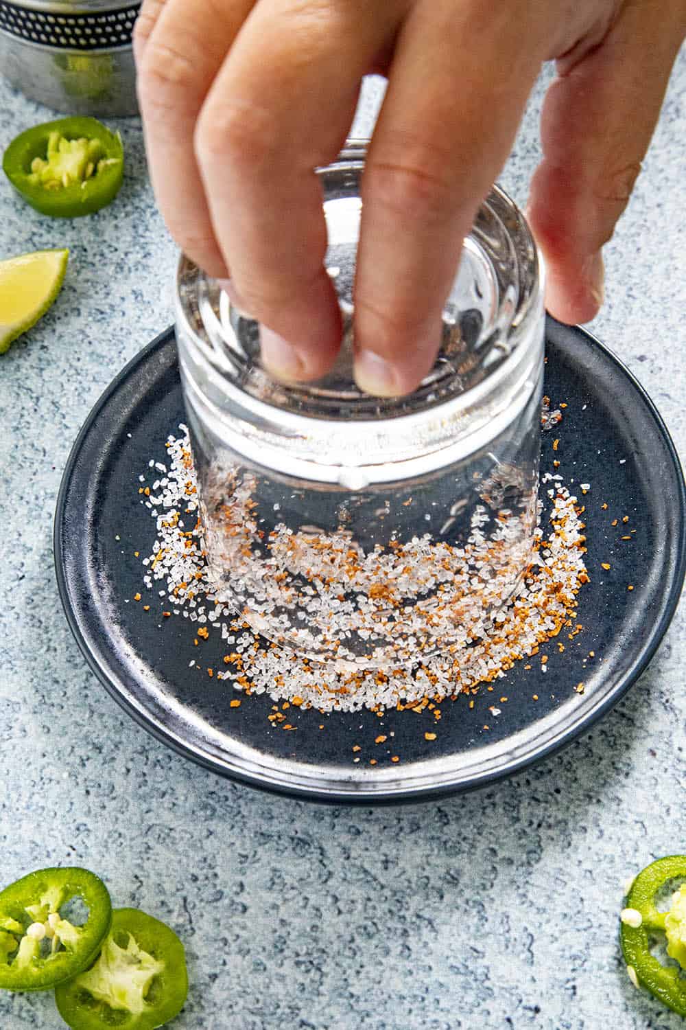 Salting the rim of the glass for our Jalapeno Margarita