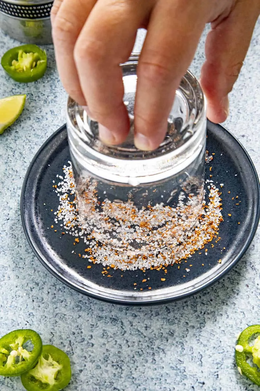 Salting the rim of the glass for our Jalapeno Margarita