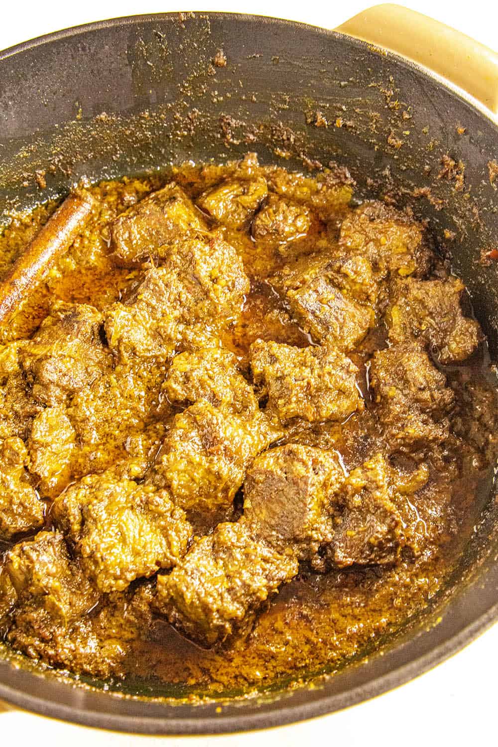 Beef rendang simmering, nearly ready to serve