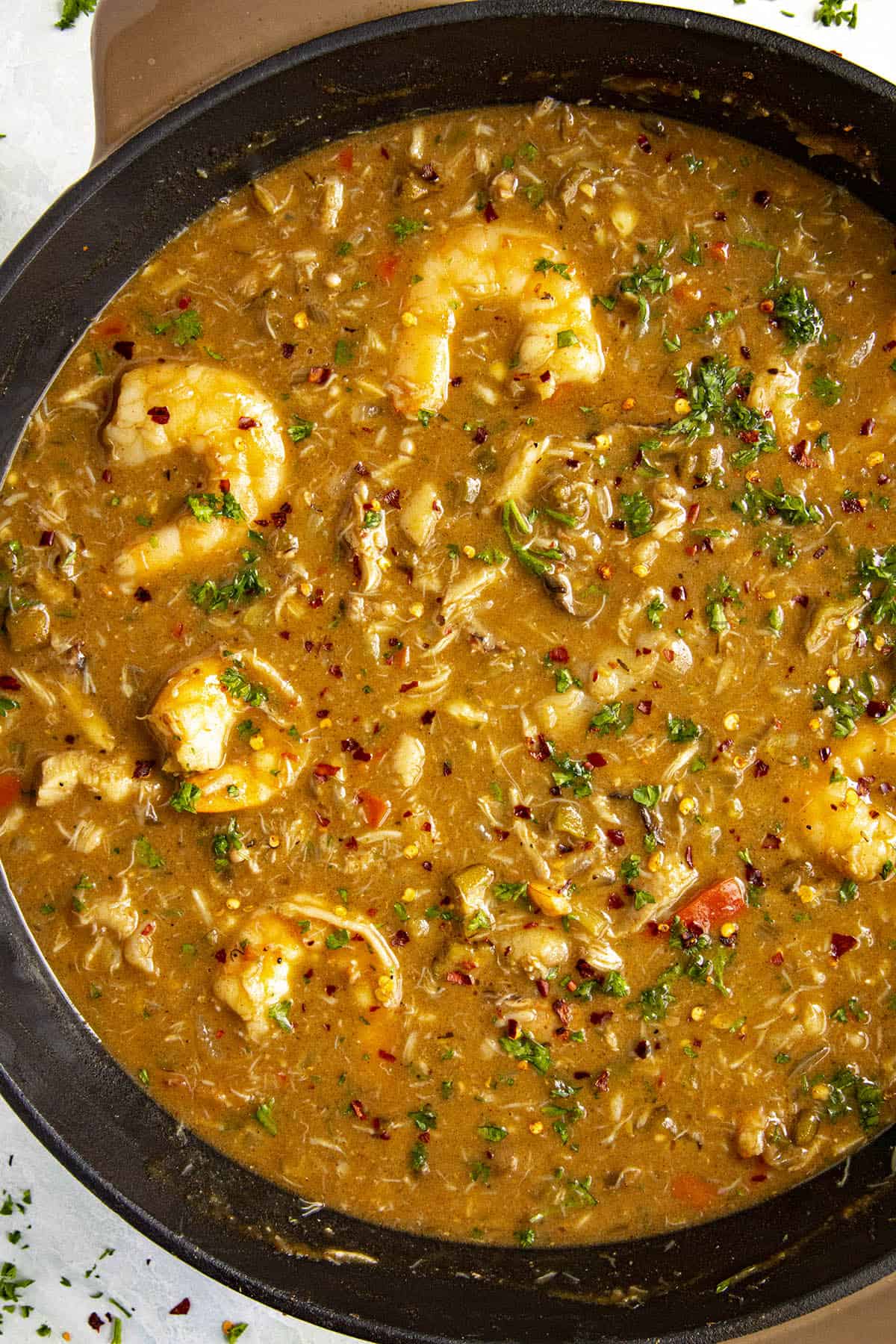 Seafood Gumbo in a pot with loads of shrimp, whitefish, crab and smoked oysters