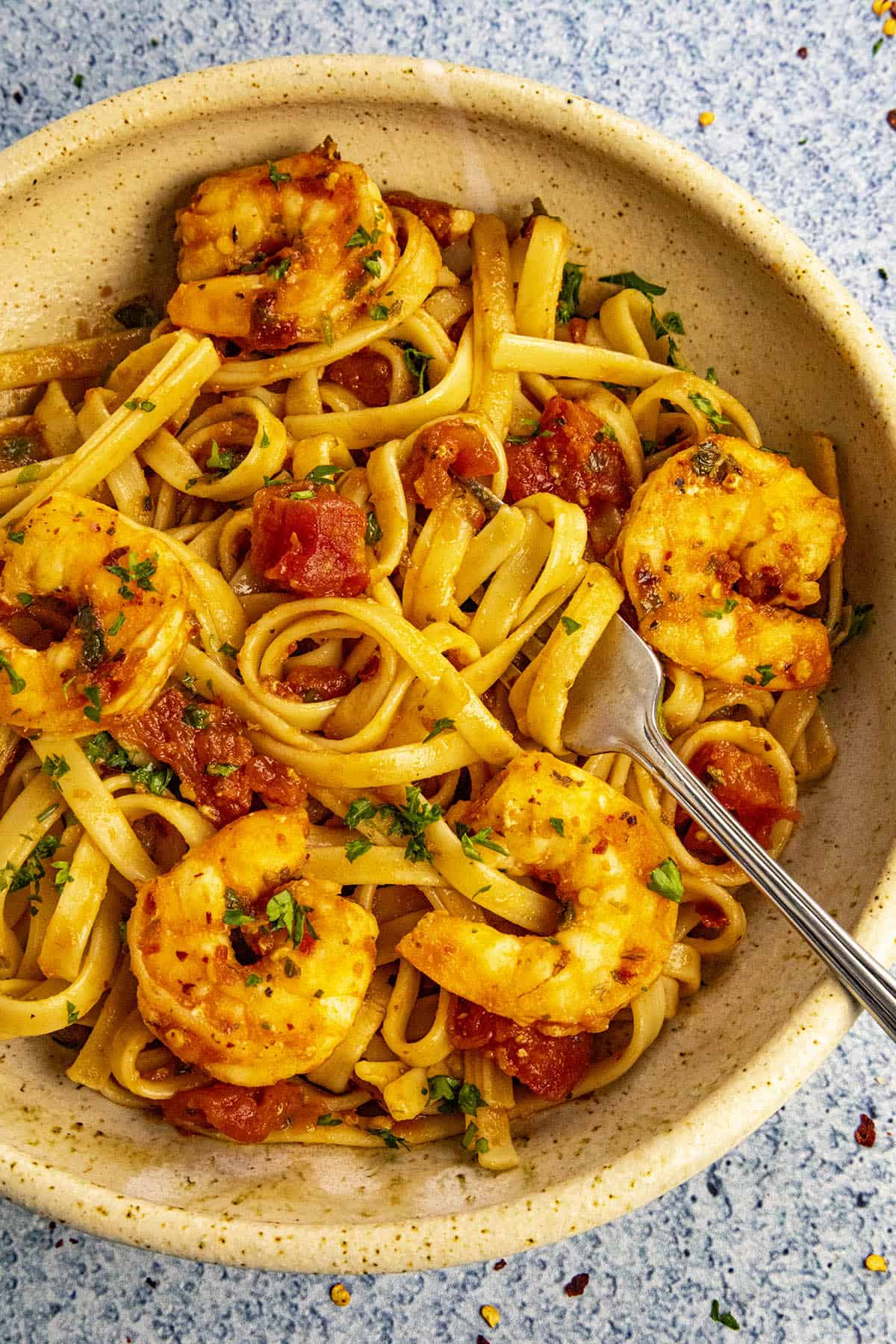 Shrimp Fra Diavolo in a bowl with extra red chili flakes