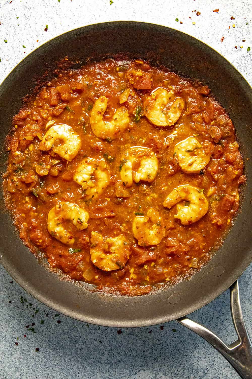 Simmering shrimp in our Fra Diavolo sauce