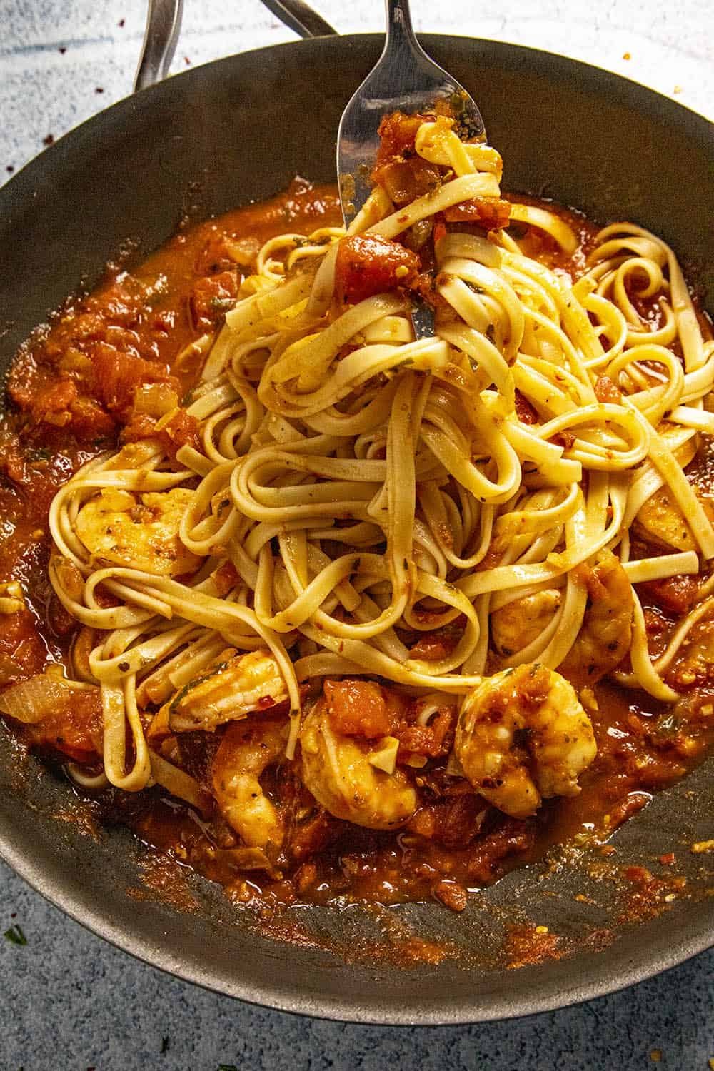 Twirling Shrimp Fra Diavolo pasta on a fork