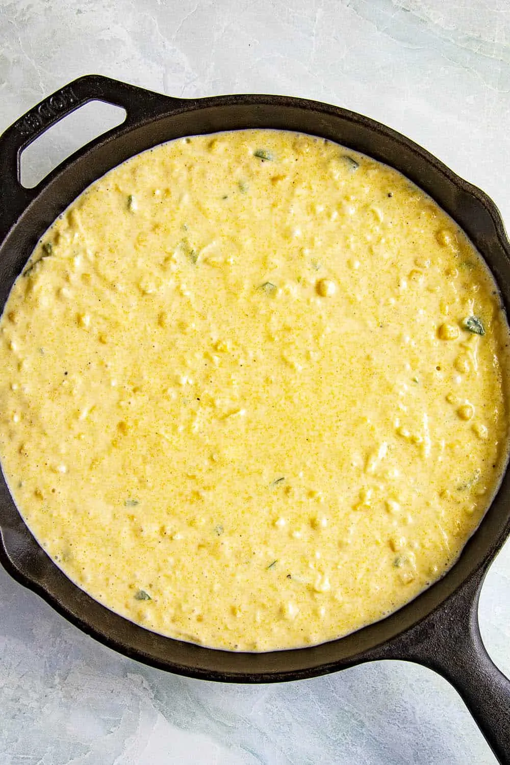 Web cornbread mix in a pan, ready to bake