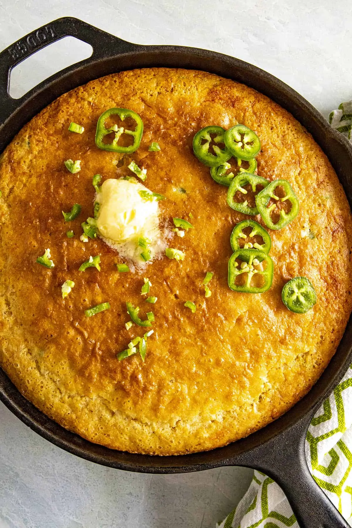 Skillet Cornbread with hot butter and extra jalapeno slices