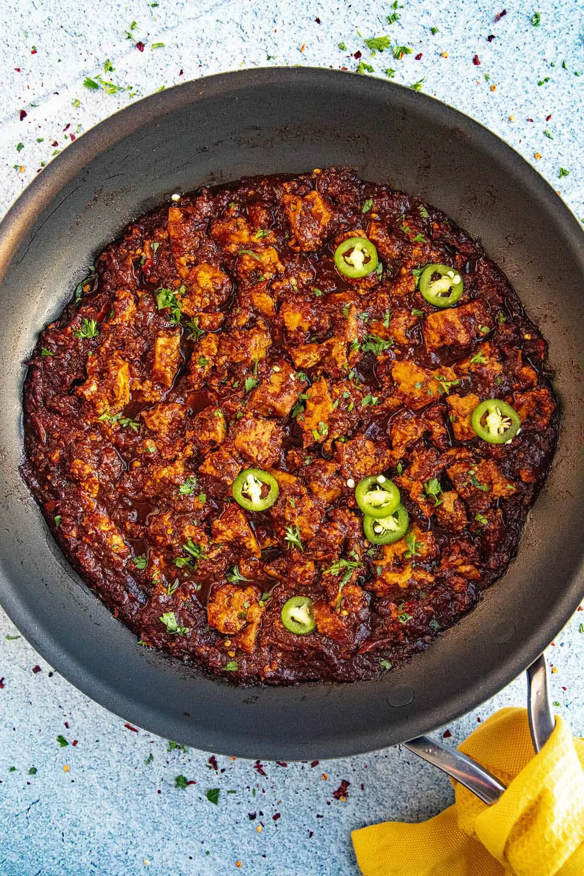 Spicy chipotle sofritas served in a pan with garnish