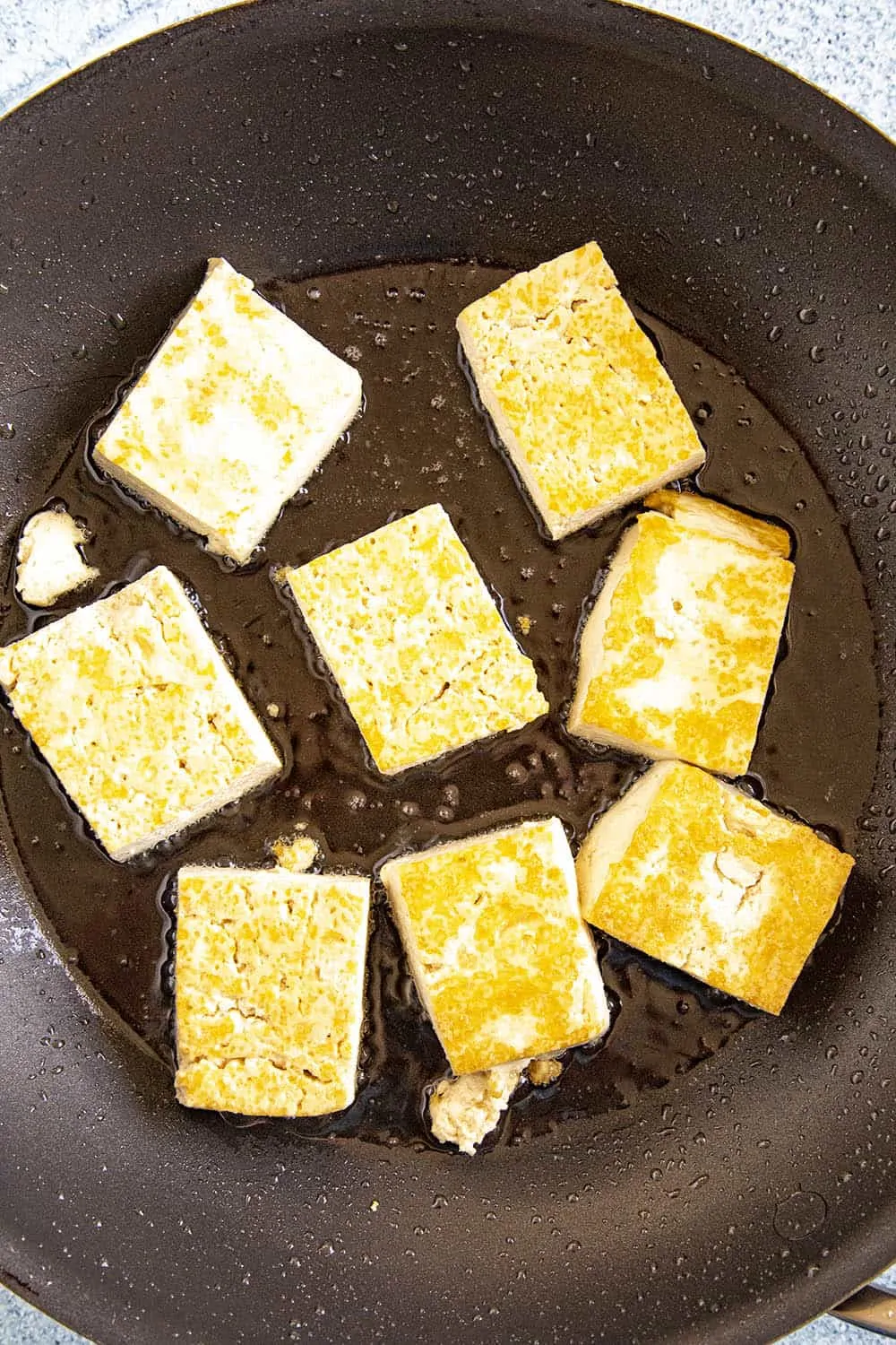 Frying blocks of tofu for making sofritas