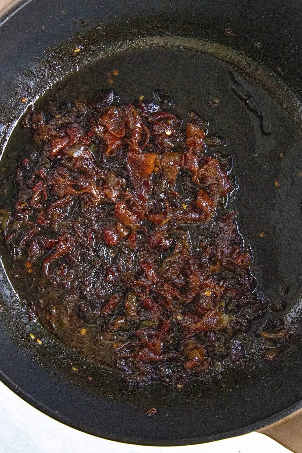 Bacon Jam simmering in a pot, thickening.