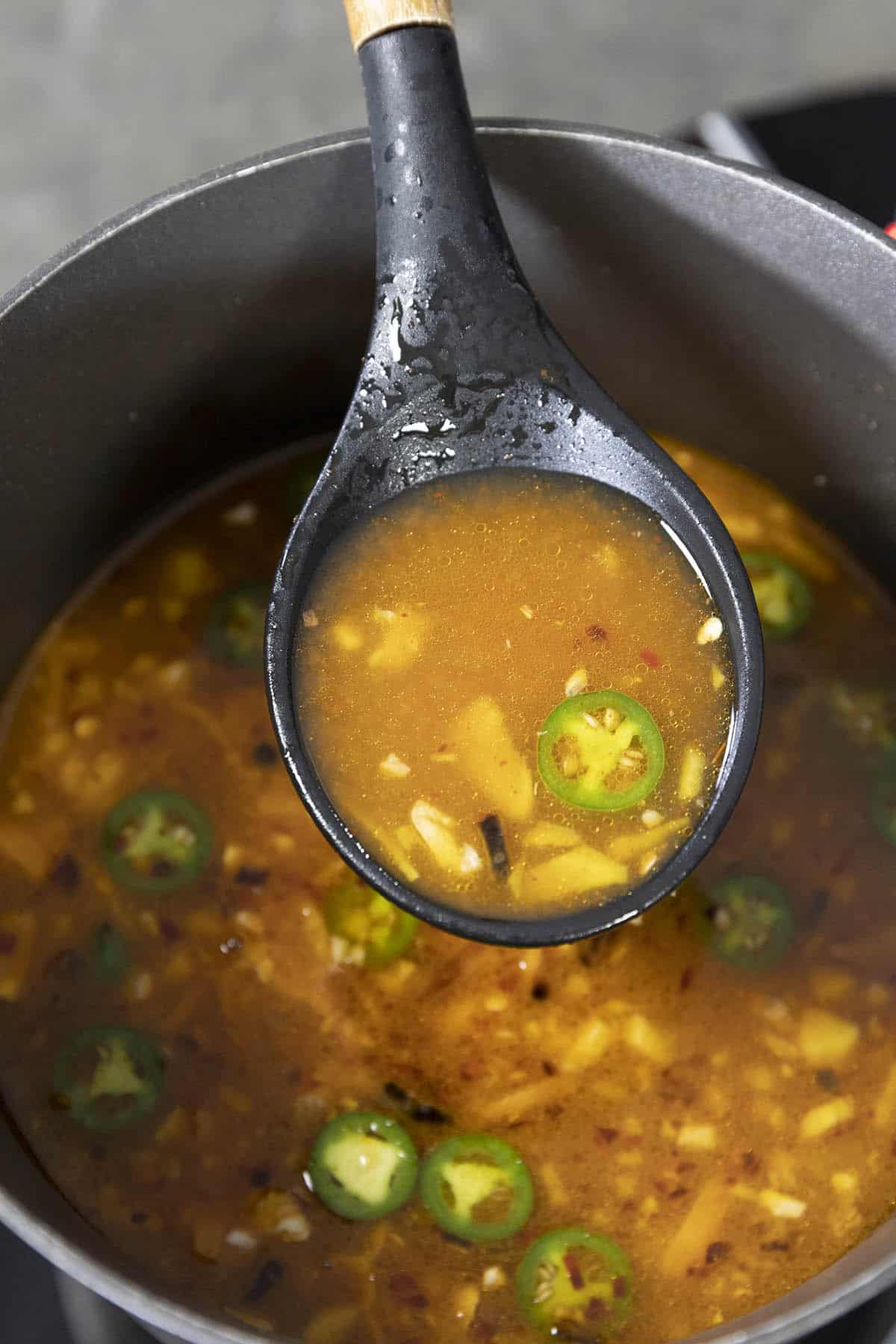 Spicy Ramen Broth on a spoon