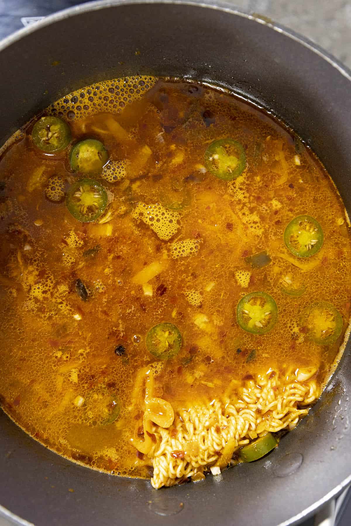 Spicy Ramen Noodles simmering in a pot