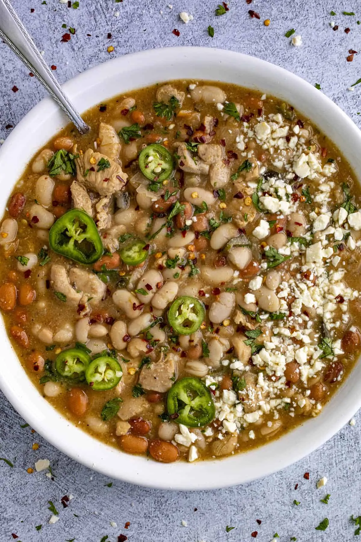 White Bean Chicken Chili in a bowl with lots of garnish