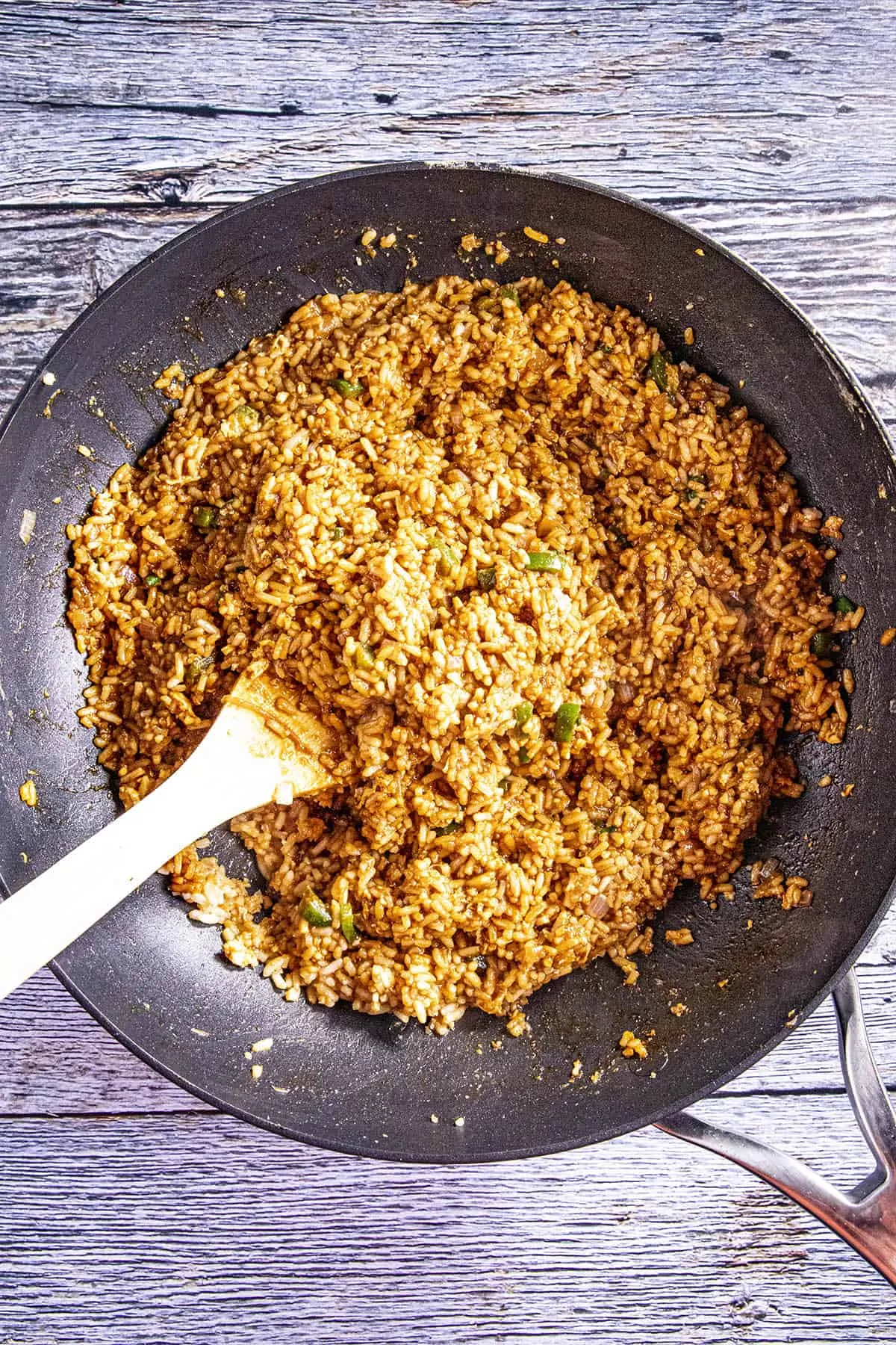 Finishing stirring up our Indonesian Fried Rice (Nasi Goreng) in a hot pan.
