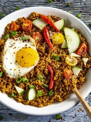 Nasi Goreng - Indonesian Fried Rice in a bowl with a fried egg on top