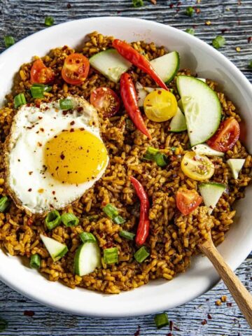 Nasi Goreng - Indonesian Fried Rice in a bowl with a fried egg on top