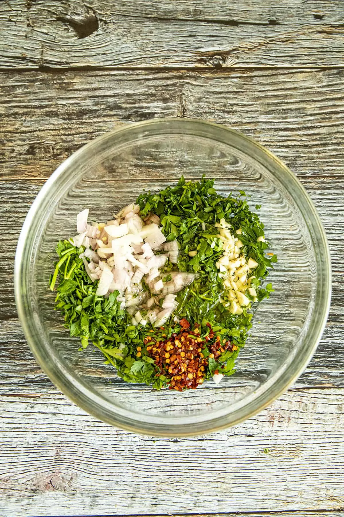 Chimichurri ingredients in a bowl.