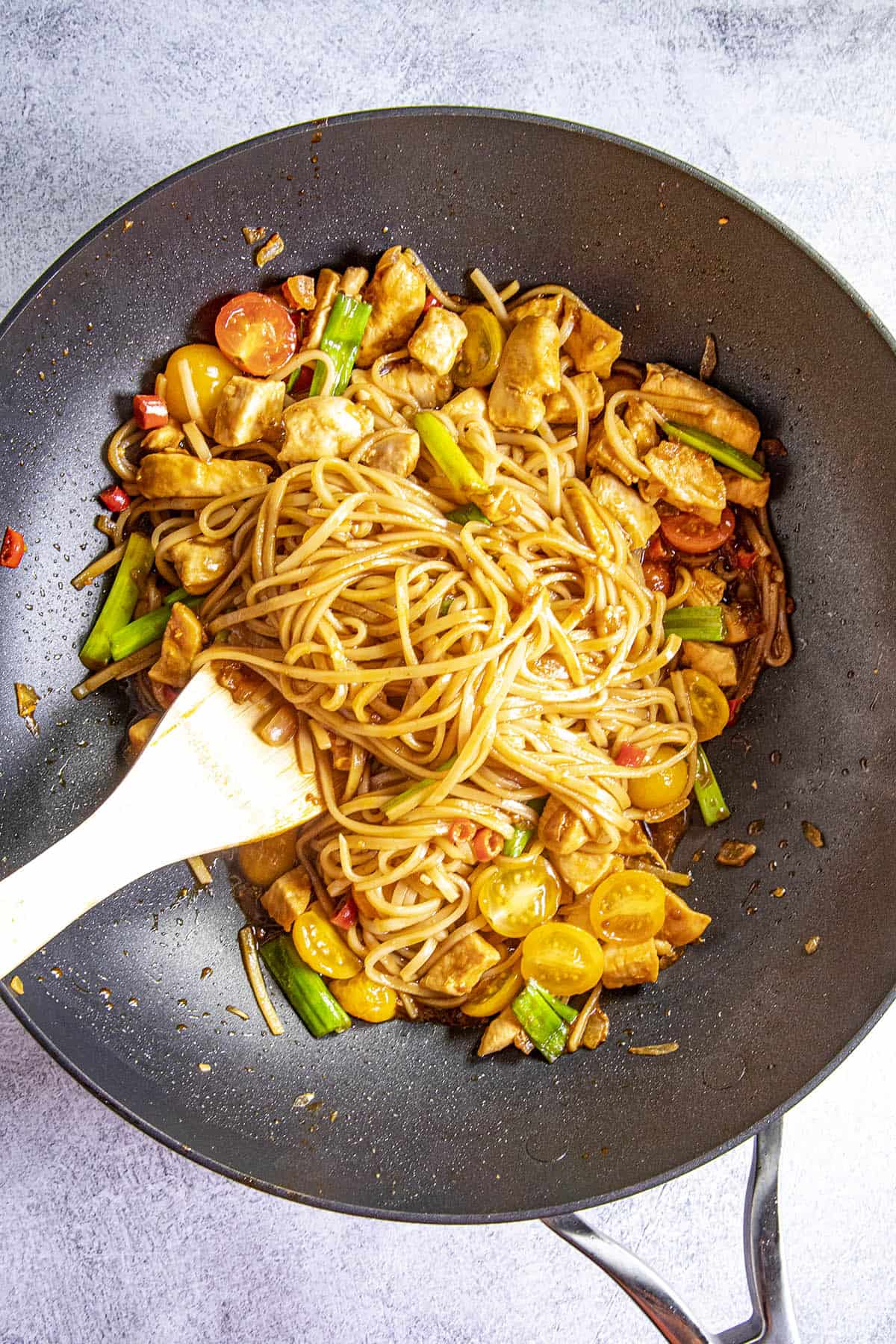 Stirring Drunken Noodles into the hot pan