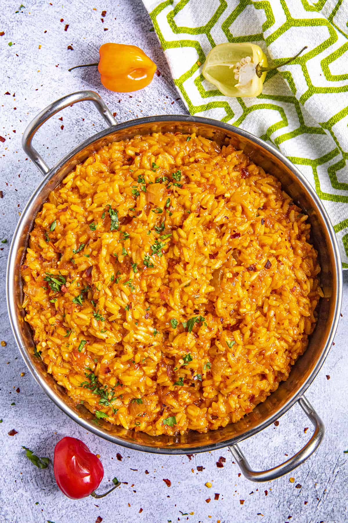 Jollof Rice in a bowl with extra scotch bonnet peppers