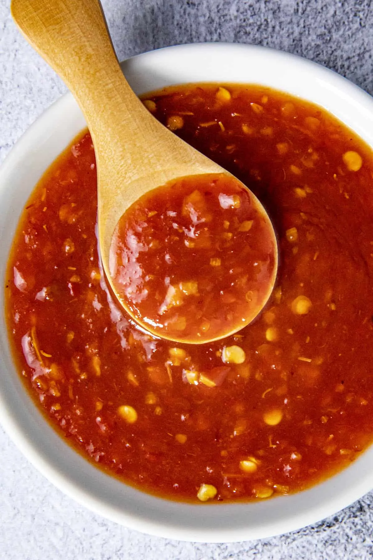 Nam Prik Pao (Thai Chili Paste) in a bowl with a spoon.