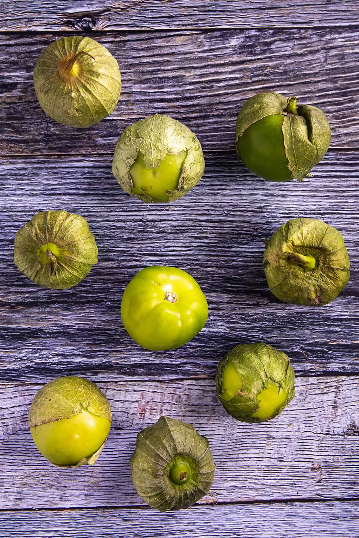 A bunch of tomatillos, ready for peeling