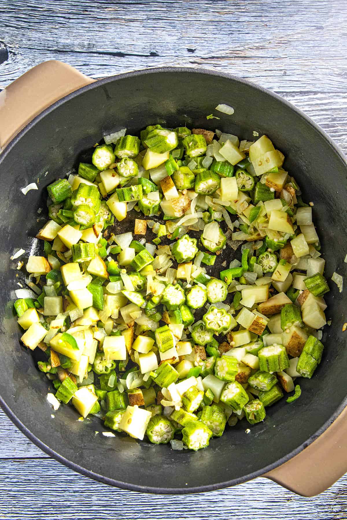 Cooking down the vegetables to make Brunswick Stew.