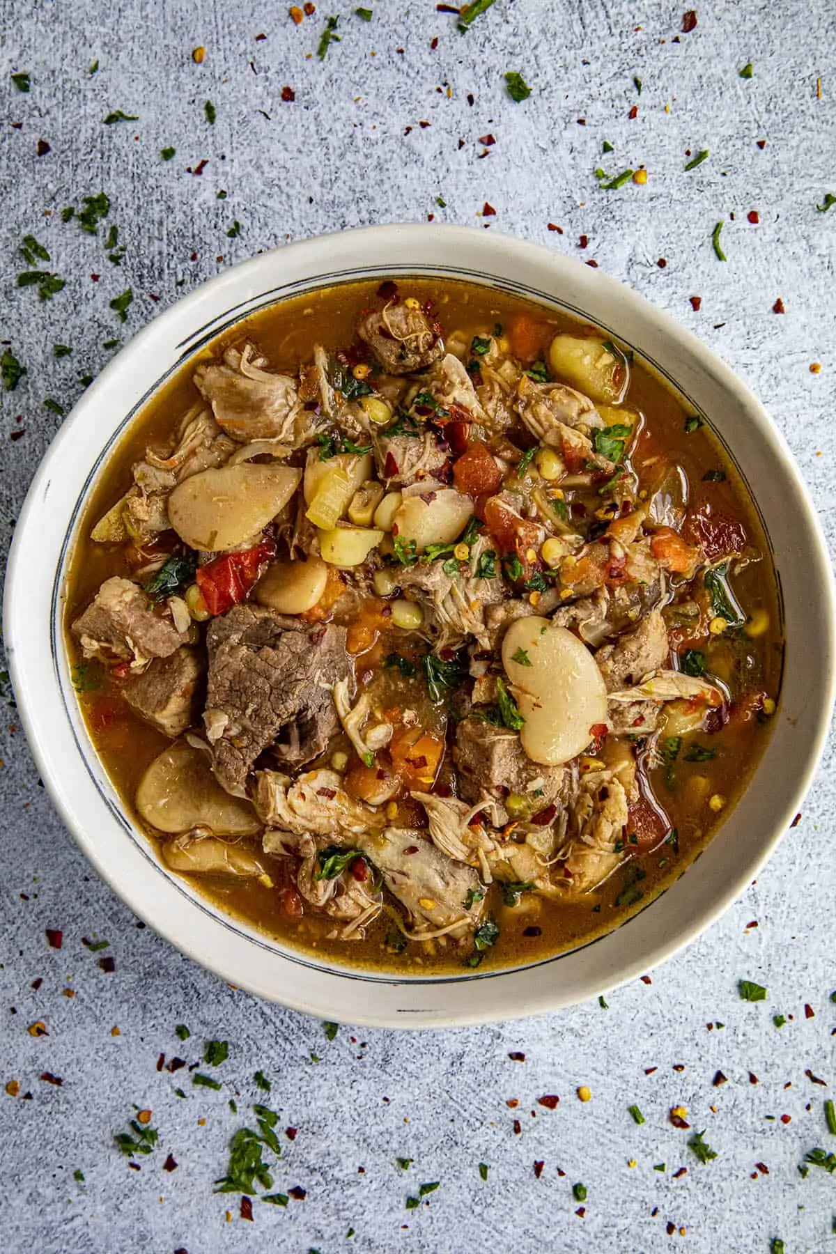 Chunky burgoo stew in a bowl with loads of meat and vegetables