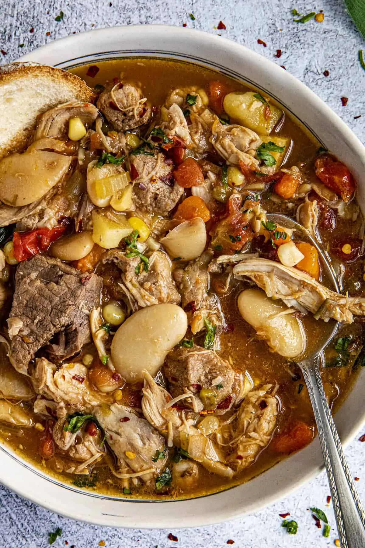 Chunky burgoo stew in a bowl with a spoon