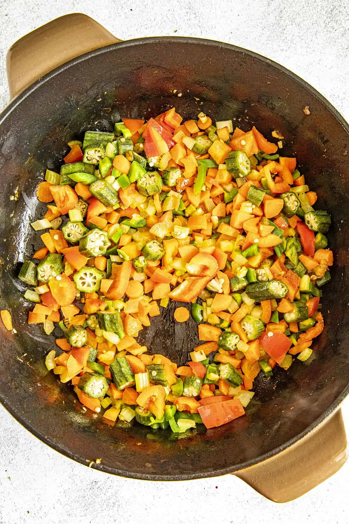 Cooking down the vegetables to make burgoo