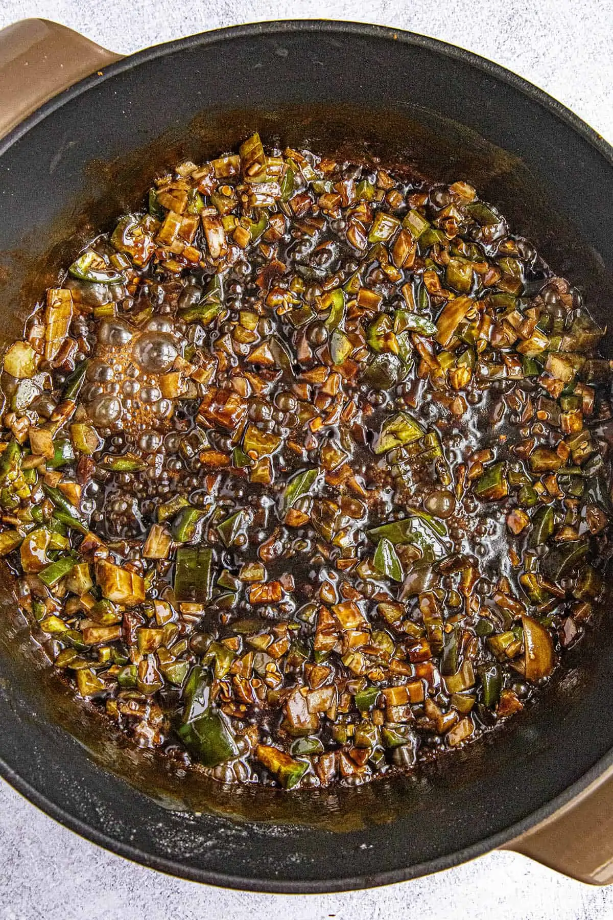 Stirring the vegetables into the roux