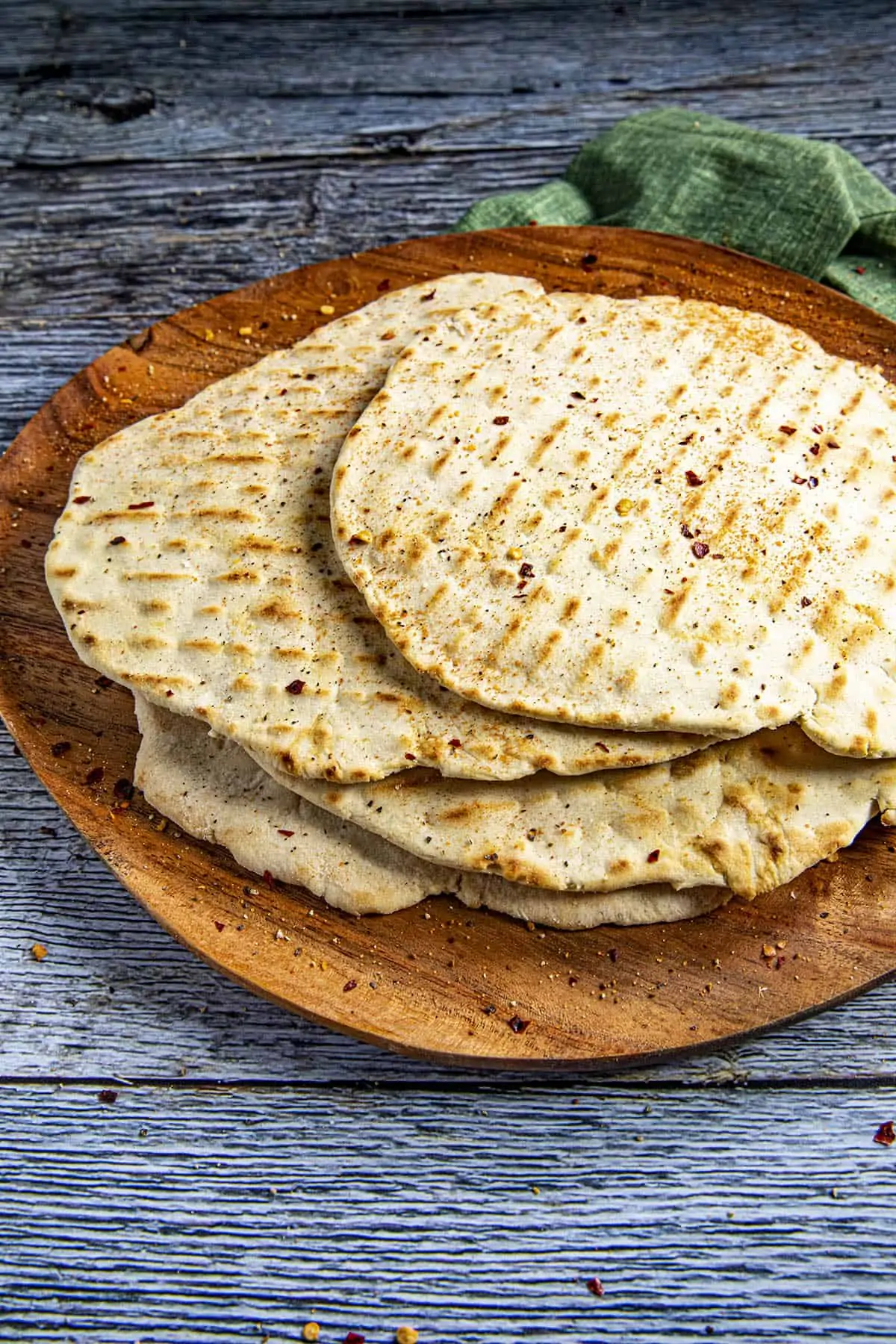 A stack of flatbreads on a plate.