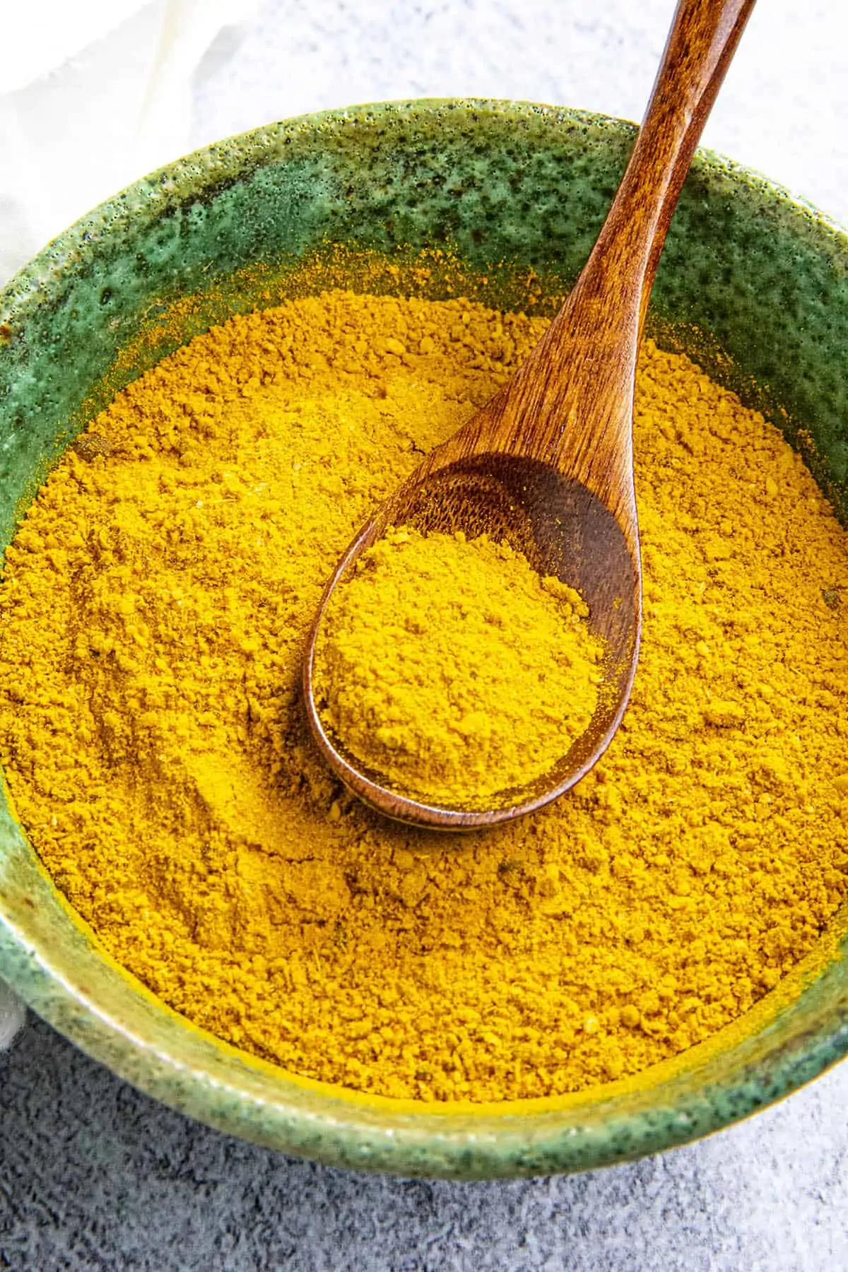Jamaican Curry Powder in a green bowl.