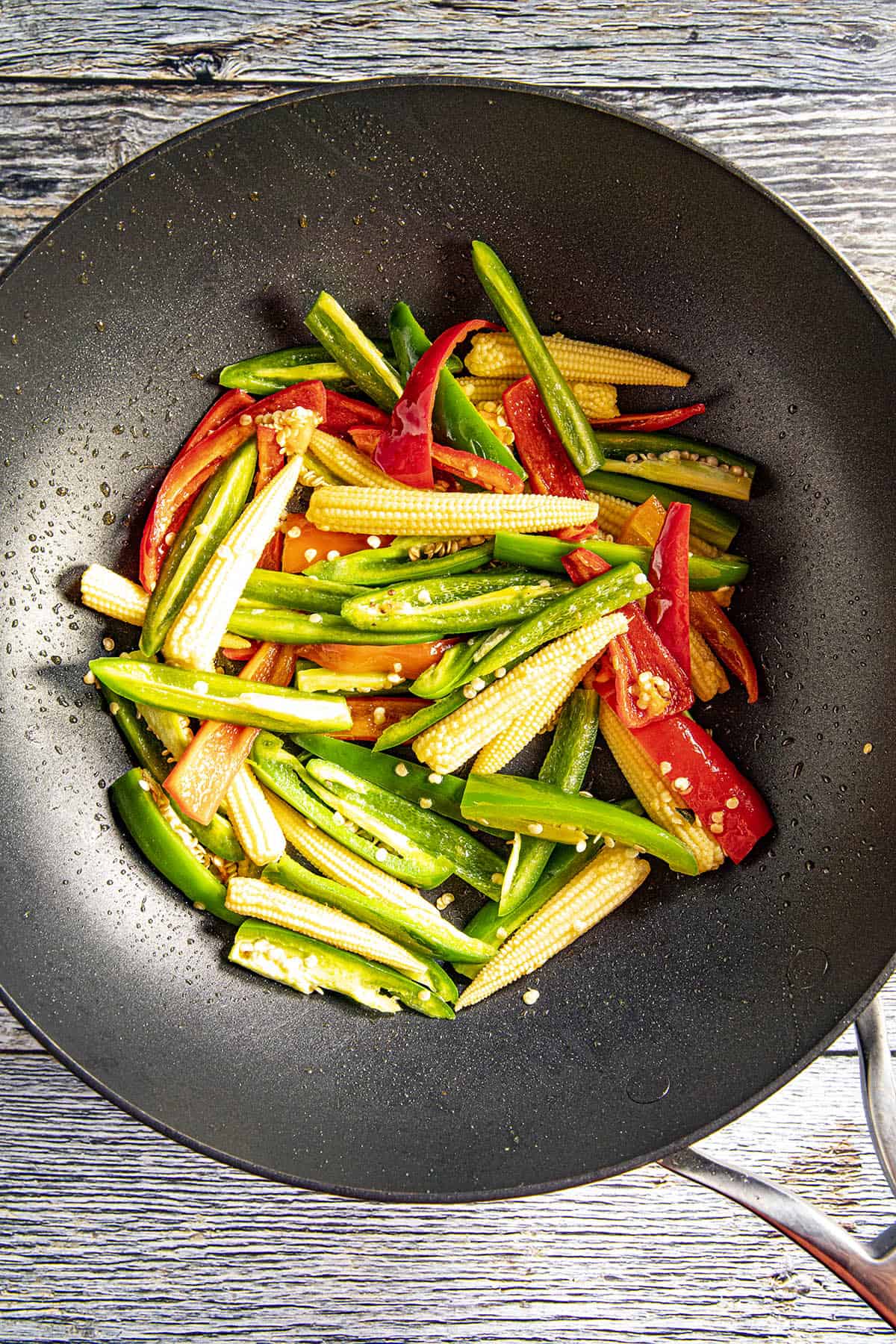 Cooking the vegetables in a pan to make Teriyaki Shrimp Stir Fry