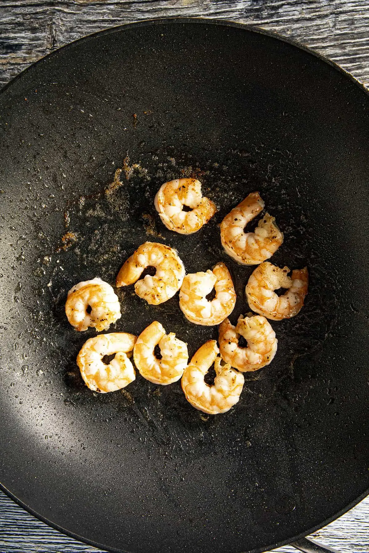Cooking the shrimp in a pan to make Teriyaki Shrimp Stir Fry