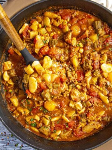 Serving a scoop of Brunswick Stew from the pot