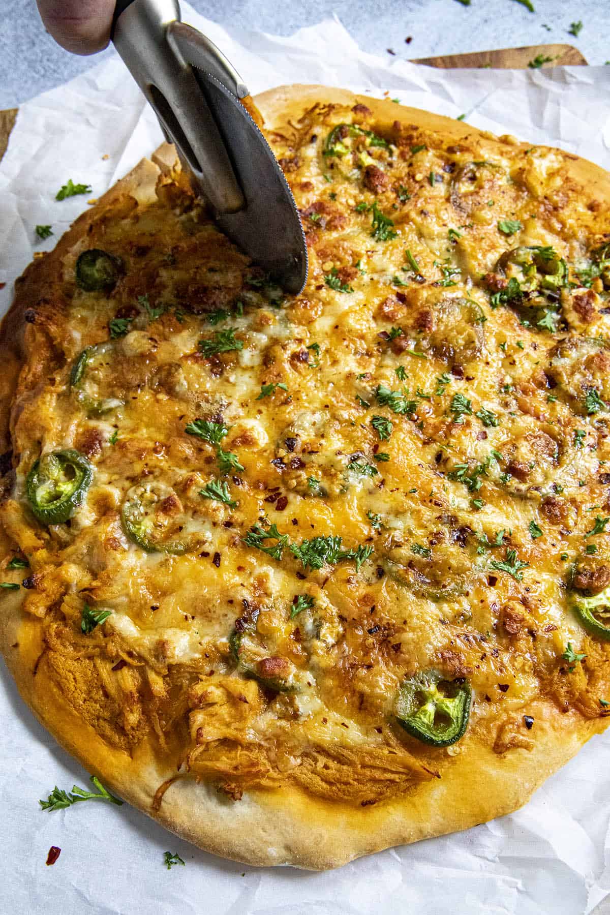 Mike cutting the Buffalo Chicken Pizza