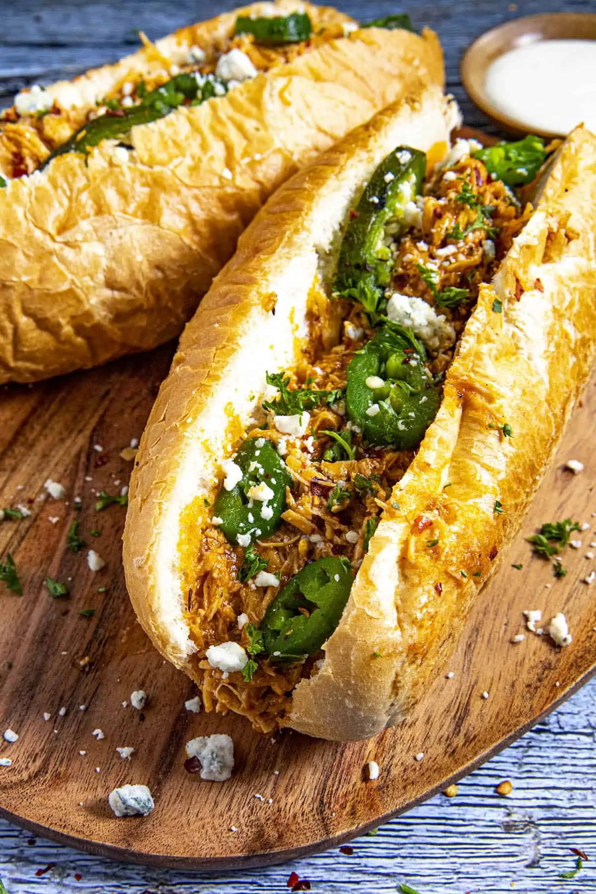 Buffalo Chicken Sandwiches with blue cheese crumbles and roasted jalapenos