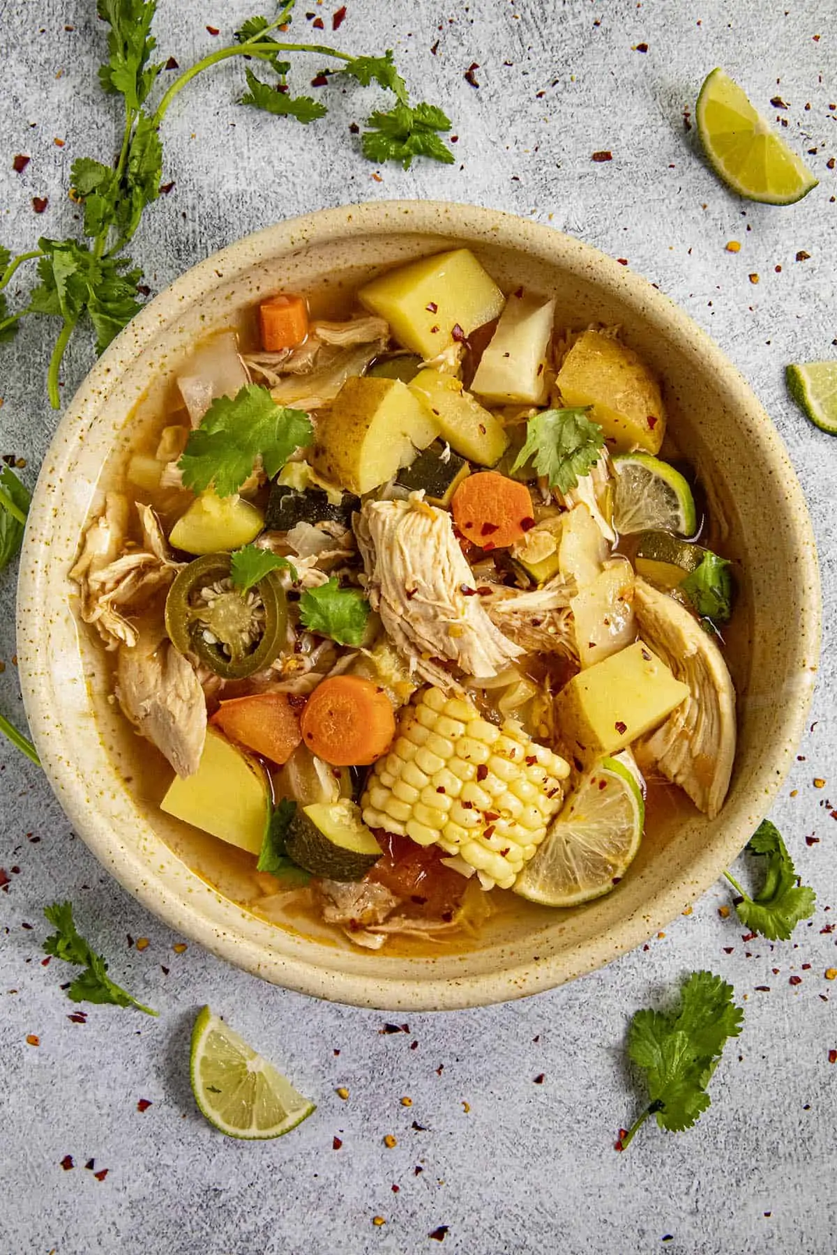 Chunky Mexican Chicken Soup in a bowl loaded with potatoes, carrots, corn and shredded chicken