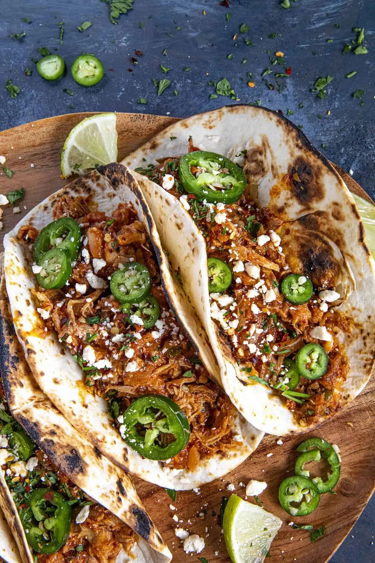 Chicken Tinga Tacos on a wooden board