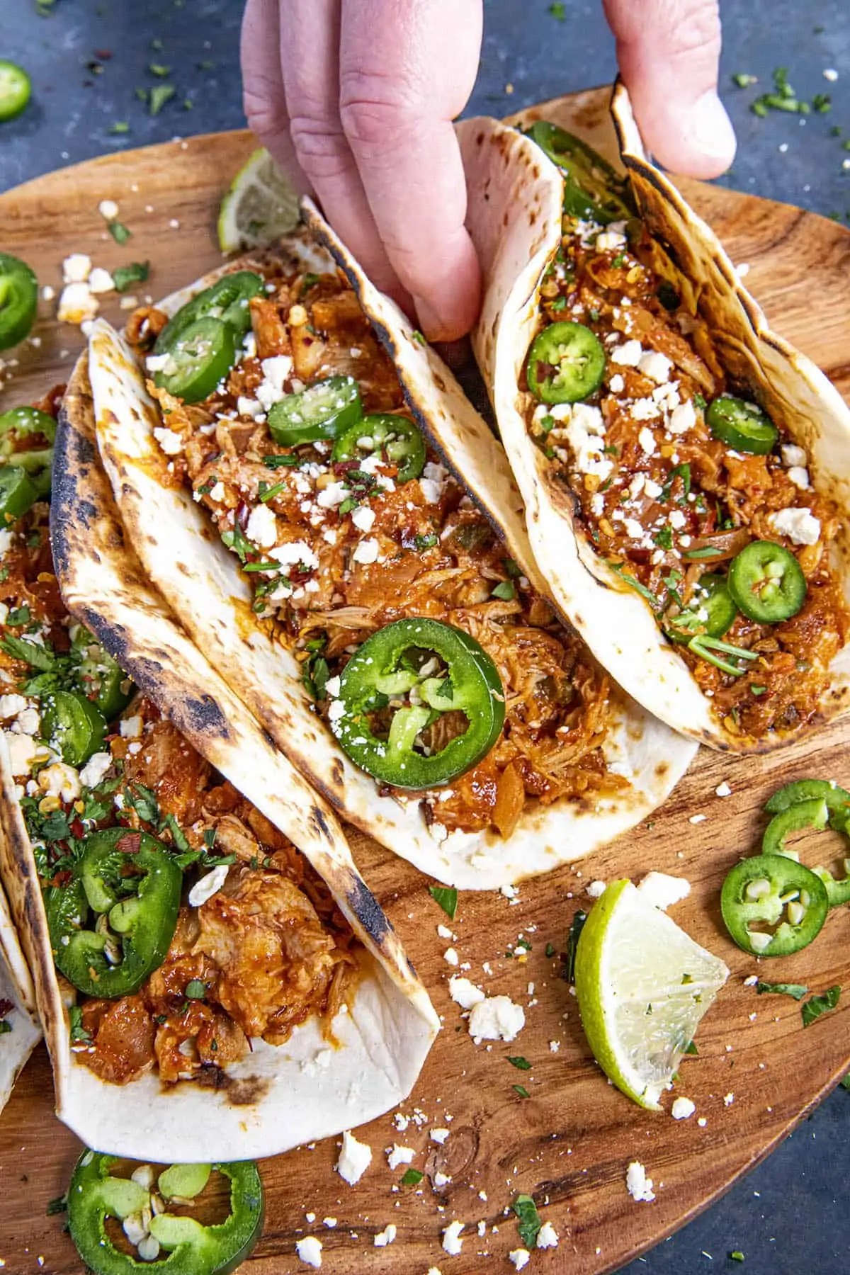 Mike grabbing a Chicken Tinga Taco from the platter