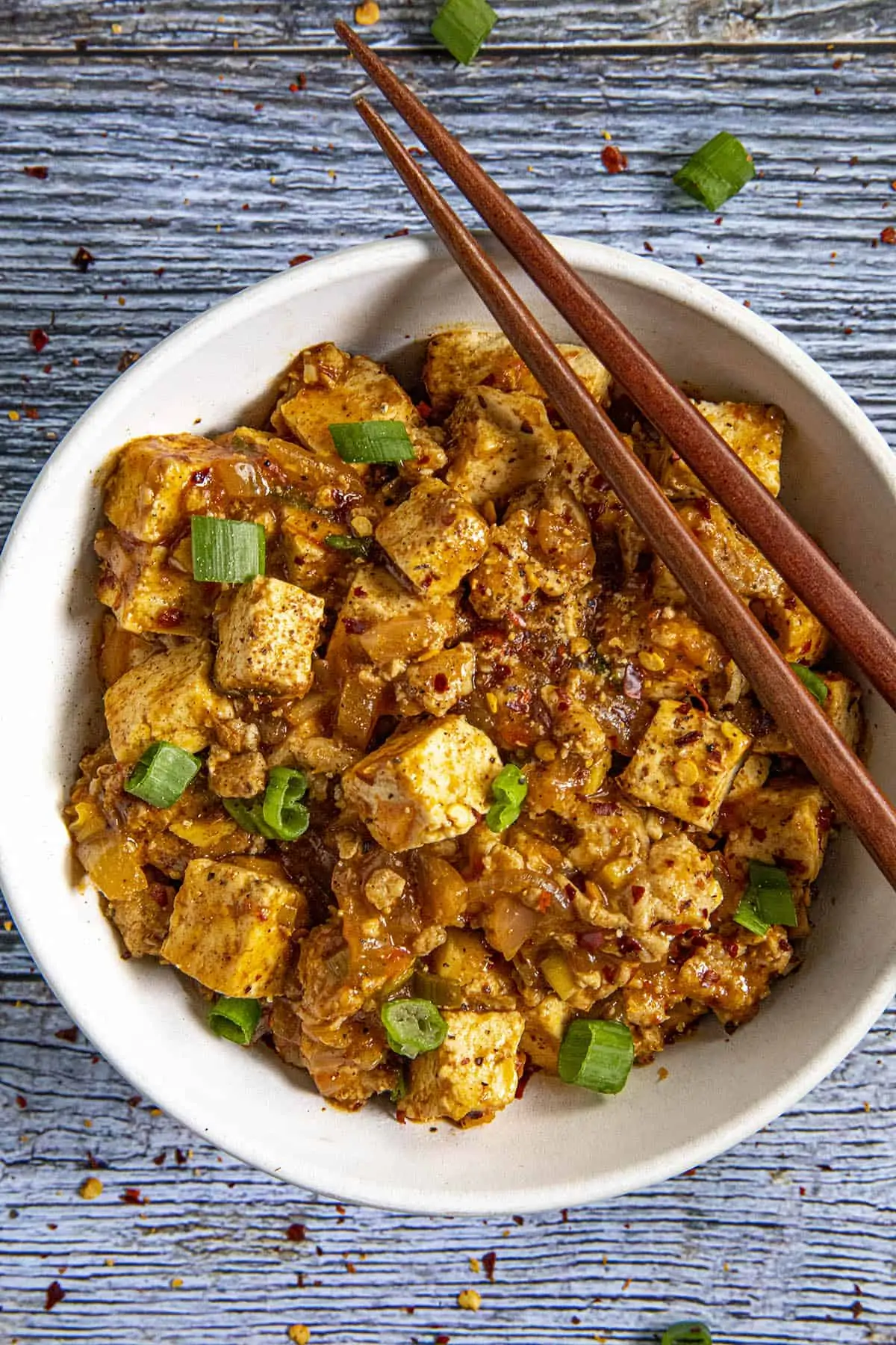 Mapo Tofu in a bowl with chopsticks.