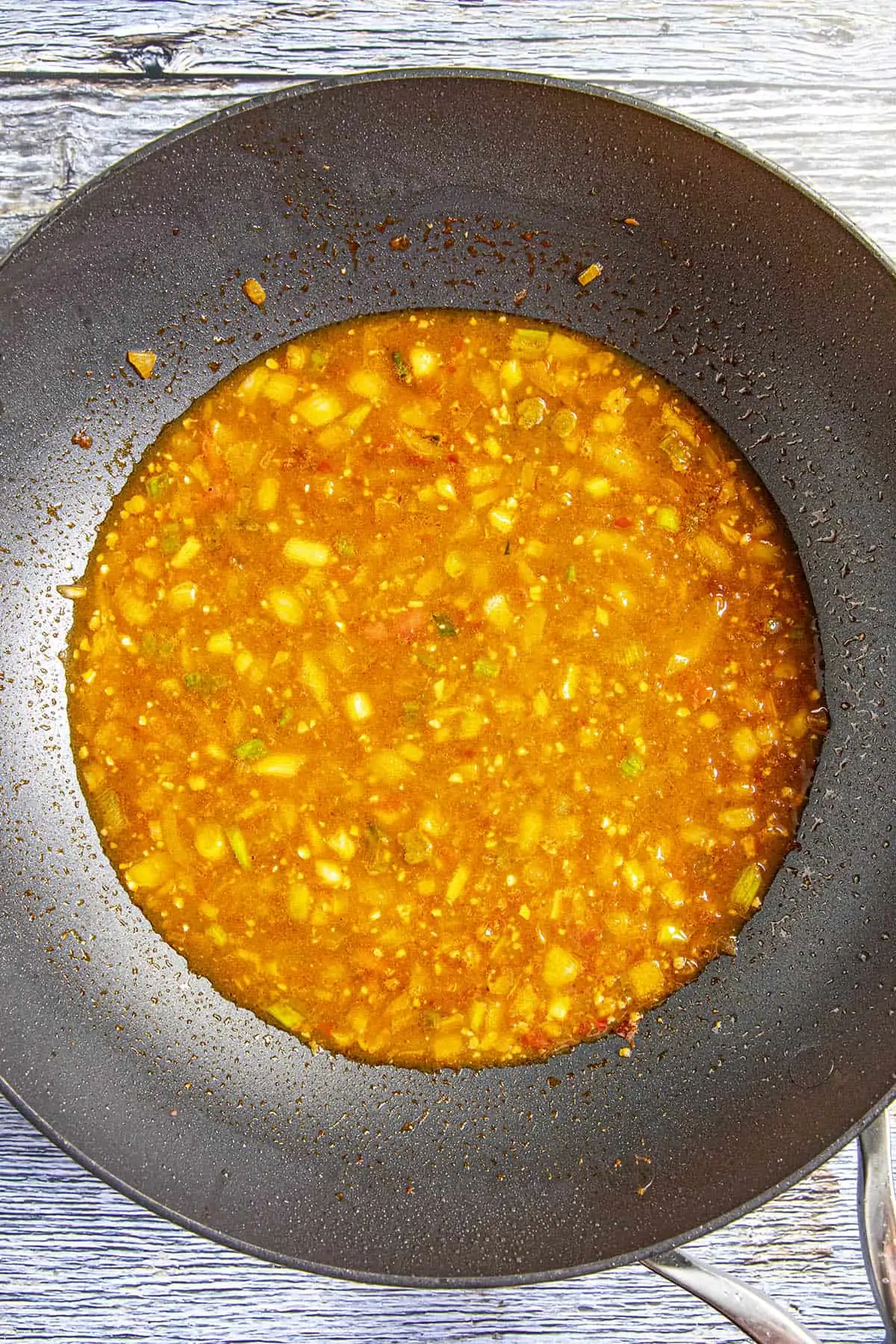 Simmering the Mapo Tofu sauce.