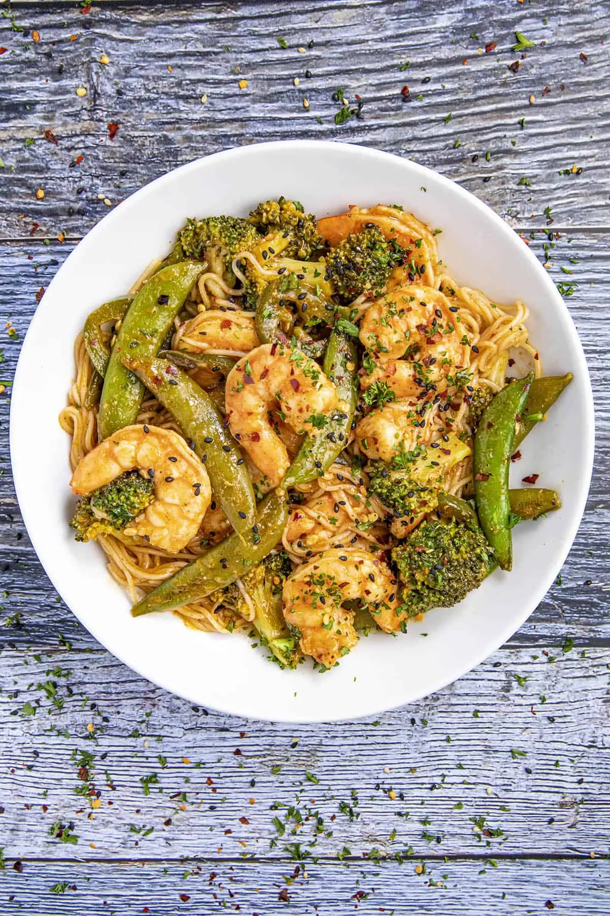 Spicy Shrimp Stir Fry in a bowl with lots of garnish