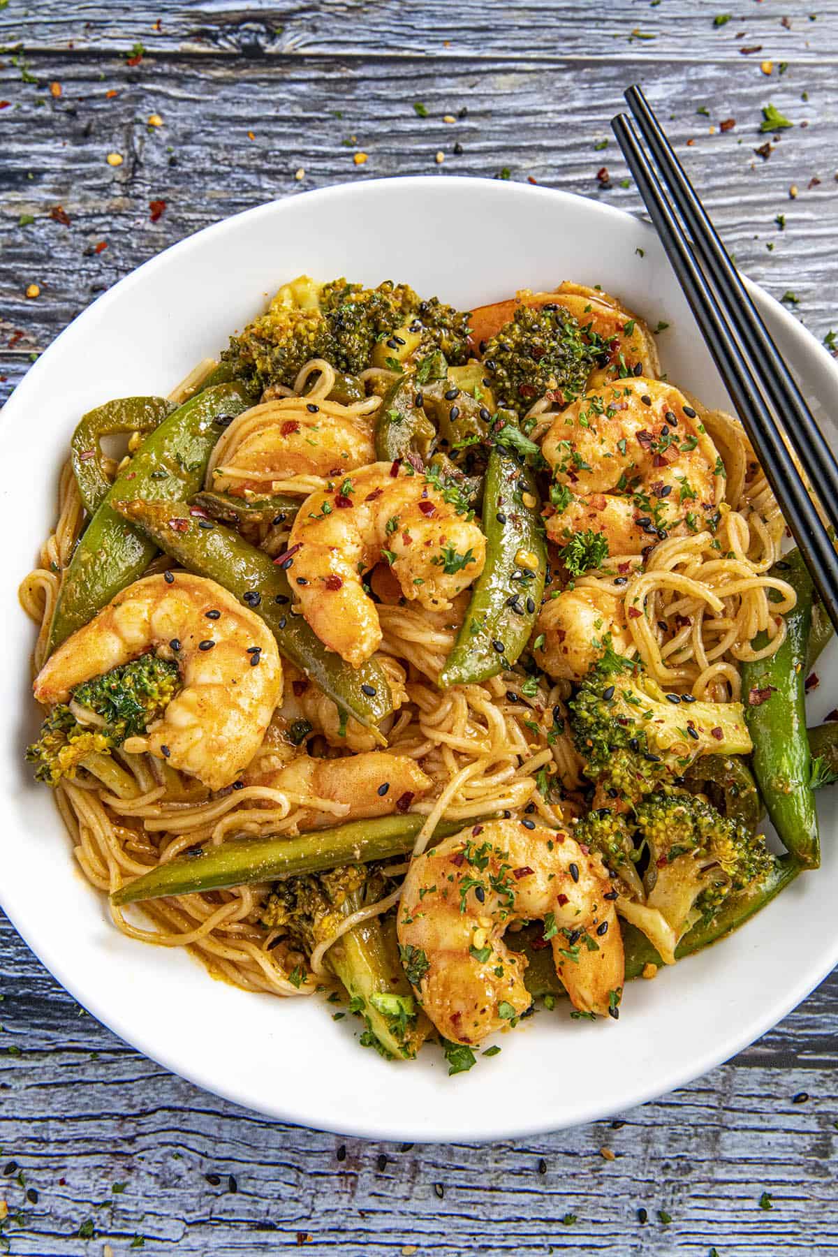 Spicy Shrimp Stir Fry in a bowl with chopsticks