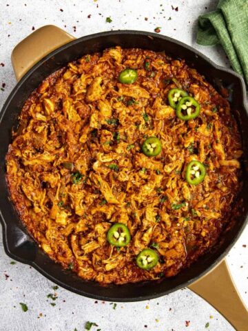 Spicy shredded Chicken Tinga in a pan