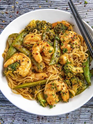 Spicy Shrimp Stir Fry in a bowl with chopsticks