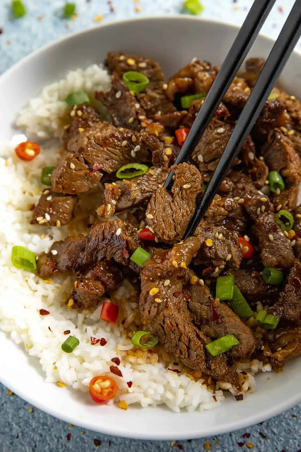 Mike taking a piece of bulgogi from the bowl