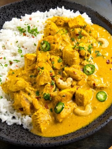 Chicken Korma ready to serve on a plate with garnish