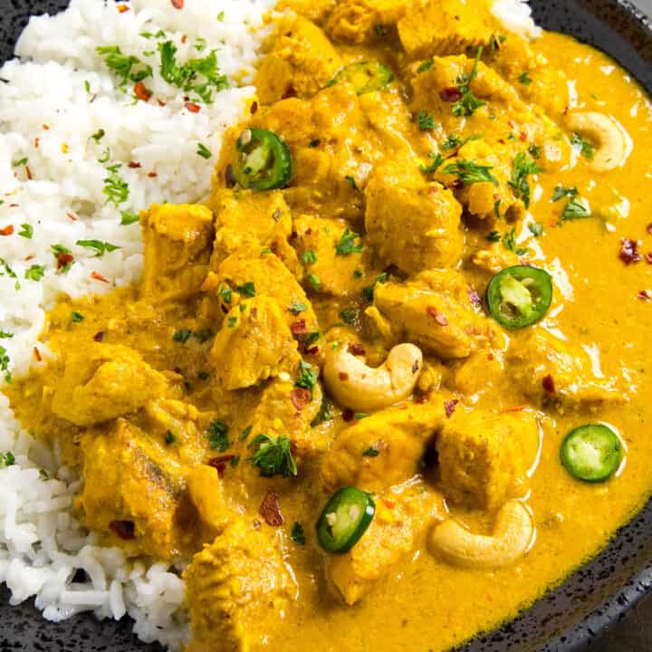 Chicken Korma ready to serve on a plate with garnish